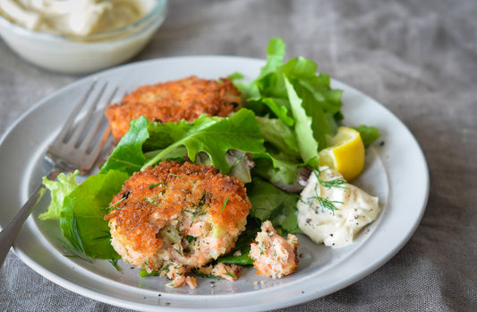 Salmon Burgers atop Baby Greens